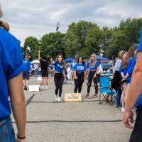 Students play cornhole game during tailgate.